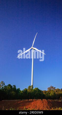 A wind turbine is a wind turbine that takes the kinetic energy from the movement of the wind and converts it into mechanical energy. Then use mechanic Stock Photo