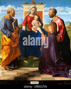 Madonna and Child Enthroned with Saints and Donor, 1505. Artist: Giovanni Bellini. Image shows painting post-restoration in 2008..  This altarpiece is something of a mystery. Nothing is known about the man who commissioned it or its original location. The inclusion of full-length saints indicates an important patron and an expensive commission.. Though the work is signed on the scrap of paper or 'cartellino' by Bellini, its production would have involved the work of assistants in his studio. Bellini's own hand can be detected in the animated naturalism of the heads of the two saints... Credit Stock Photo