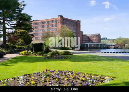 Belper Derbyshire Belper River Gardens and River Derwent Strutt’s North Mill a pioneering fire-proof cotton mill Belper Derbyshire England UK GB Stock Photo