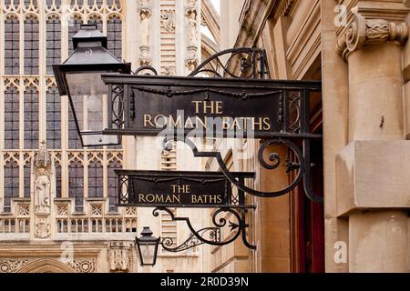 Signage outside the Roman baths in the centre of the city of Bath,Somerset, UK. Stock Photo