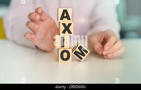 Axiom - word on wooden cubes on white background, concept Stock Photo