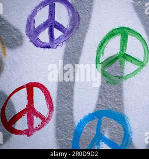 colorful peace symbols painted on a wall Stock Photo