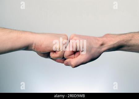 Premium Photo  Teamwork and friendship Partnership concept Man giving fist  bump Bumping fists together Fist Bump Clash of two fists Concept of  confrontation competition Gesture of giving respect or approval