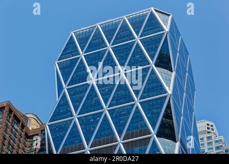 The diagrid glass Hearst Tower was built in 2006 atop the stone Hearst Magazine Building of 1928. Stock Photo