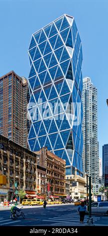 The diagrid glass Hearst Tower was built in 2006 atop the stone Hearst Magazine Building of 1928. Stock Photo