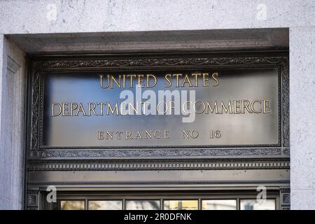 Washington, DC - April 4, 2023 : United States Department of Commerce sign and entrance at the Herbert C. Hoover Building Stock Photo