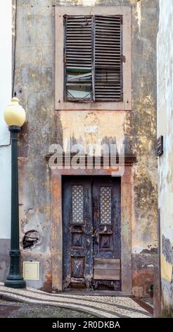 Derelict door and building Funchal town, Madeira, Portugal Stock Photo