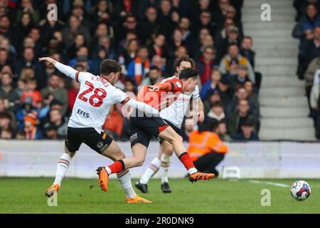 Callum Jones #28 of Hull City pulls Louie Watson #20 of Luton Town during the Sky Bet Championship match Luton Town vs Hull City at Kenilworth Road, Luton, United Kingdom, 8th May 2023  (Photo by Arron Gent/News Images) Stock Photo