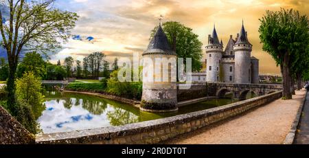 great medieval catsles of Loire valley in France. beautiful impressive Sully-sul-Loire over sunset Stock Photo
