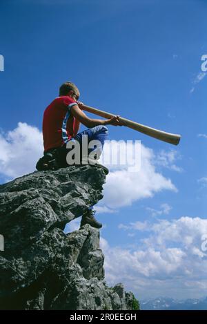 Man playing a Didgeridoo, Salzburger Land, Austria Stock Photo