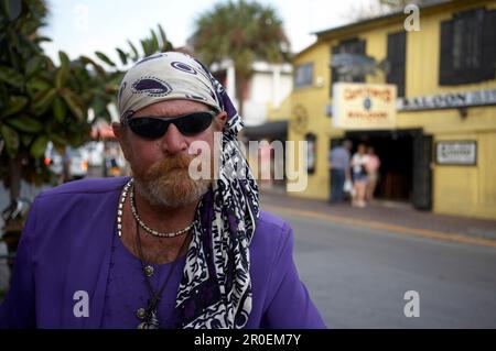 Local artist with a hairdress and sunglasses, Key West, Florida Keys, Florida, USA Stock Photo