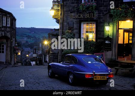 Jaguar E-Type in front of a pub in the evening, Haworth, Yorkshire, England, Great Britain, Europe Stock Photo