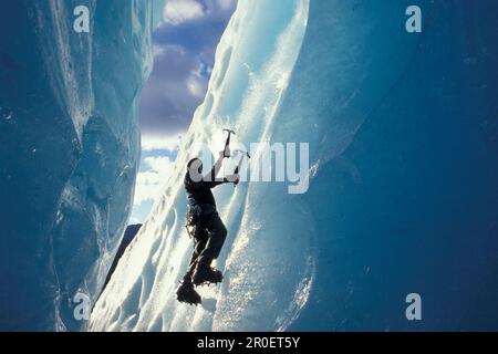 Ice climber on steep climb, Briksdal Glacier, Norway Stock Photo