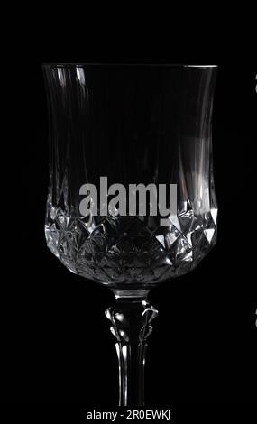 Silhouette of a crystal wine glass on a black background Stock Photo