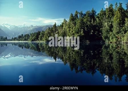 Reflections of Southern Alps and Mount Tasman and Cook on Lake Matheson, South Island, New Zealand, Oceania