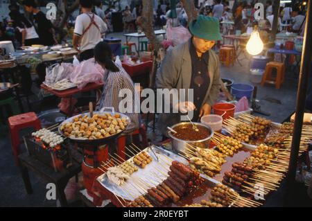 People at cookshops at Na Phra Lan old town in the evening, Bangkok, Thailand, Asia Stock Photo