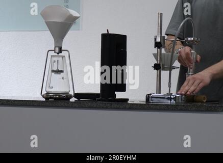 man's hands making V60 coffee Stock Photo