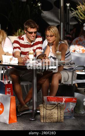 Couple drinking Latte Macchiato in a cafe, shopping break, Cape Town, South Africa