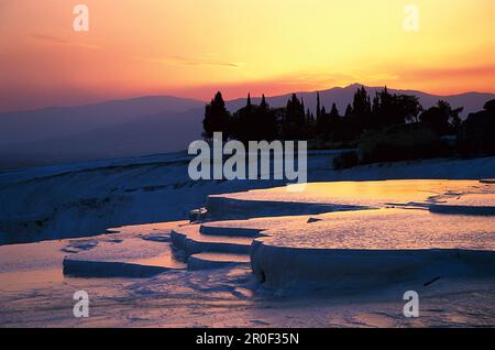 Sunset over the limestone sinter terraces, Pamukkale, Denizli, Turkey Stock Photo