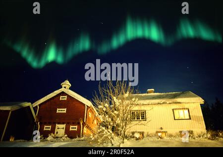 Northern lights above traditional wooden house, Lillehammer, Norway, Scandinavia, Europe Stock Photo