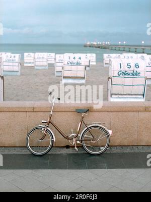 Hooded beach chairs on sandy beach, Groemitz, Schleswig Holstein, Germany Stock Photo