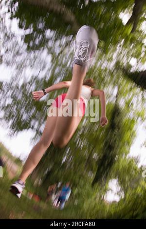 Woman jogging, low angle view Stock Photo