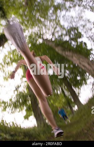 Woman jogging, low angle view Stock Photo