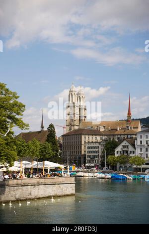 View over river Limmat to Restaurant Bauschaenzli, Großmuenster in the background, Zurich, Canton Zurich, Switzerland Stock Photo