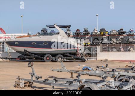 slipway with trailers for boats and yachts and a rack of jet skis at a Yamaha dealer in the marina of the town of Altea in the province of Alicante Stock Photo