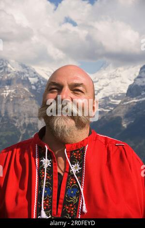 Swiss man smiling in the camera, Portrait, Bussalp 1800 m, Grindelwald, Bernese Oberland, Canton of Bern, Switzerland Stock Photo