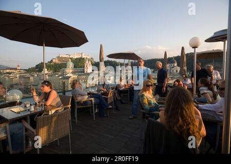 Group on terrace of chalet, portrait Stock Photo - Alamy