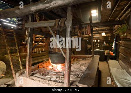 Open fireplace, which is still used daily, Karseggalm (1603 m, one of the oldest mountain hut in the valley), Grossarl Valley, Salzburg, Austria Stock Photo