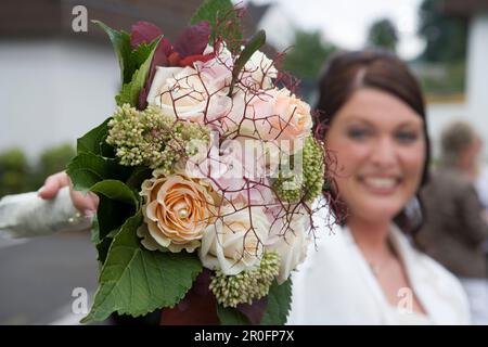 Bride with bridal bouquet, Hauneck, Hesse, Germany Stock Photo