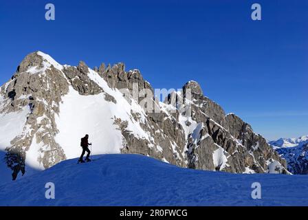 Backcountry skier against mountain scenery, Kleinwalsertal, Allgaeu Alps, Vorarlberg, Austria Stock Photo