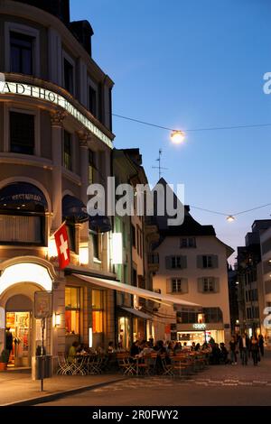 People sitting in a cafe in the evening light, Barfuesserplatz, Gerbergasse, Basel, Switzerland Stock Photo