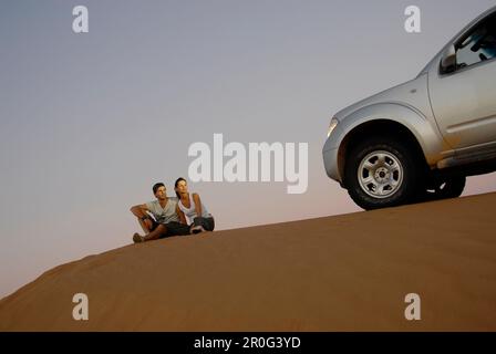 People and detail of an all-terrain vehicle on a dune, Wahiba Sands, Oman, Asia Stock Photo