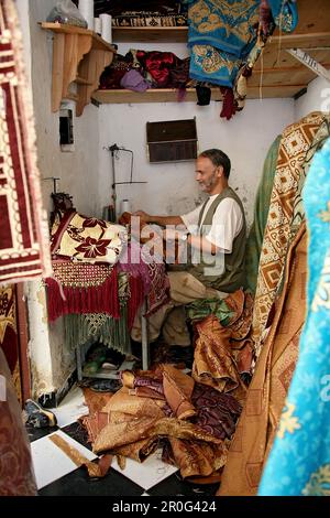 A tailor at his workshop at the medina of Fes, Morocco, Africa Stock Photo