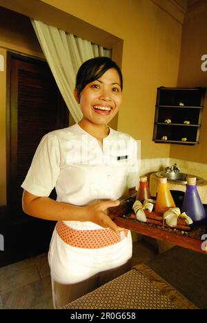 Laughing masseuse at the spa at Four Seasons Resort at Jimbaran, South Bali, Indonesia, Asia Stock Photo
