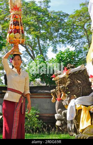 Young woman bringing oblation to the temple of the hotel, Nusa Dua Beach Hotel, Nusa Dua, Bali, Indonesia, Asia Stock Photo