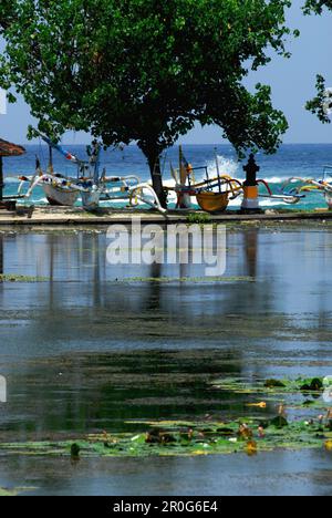Pond at Candi Dasa with boats on the shore, Candi Dasa, Bali, Indonesia, Asia Stock Photo