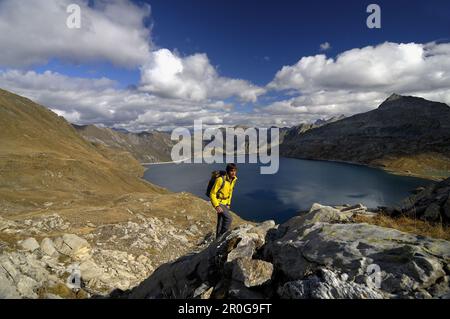 Mountain hiker near Lago del Sambuco, Val Lavizzara, Fusio, Canton of Ticino, Switzerland Stock Photo