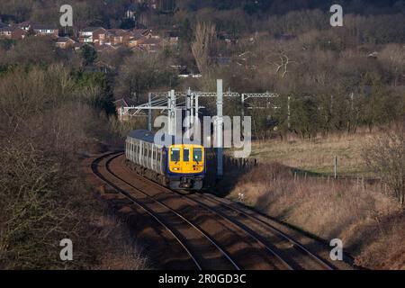 Northern Rail class 769 bi mode flex train 769448 heading away from the electrified main line at Lostock junction while running on diesel Stock Photo