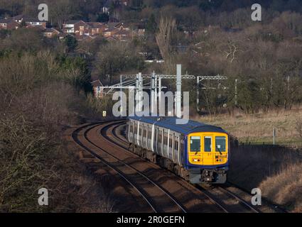 Northern Rail class 769 bi mode flex train 769448 heading away from the electrified main line at Lostock junction while running on diesel Stock Photo