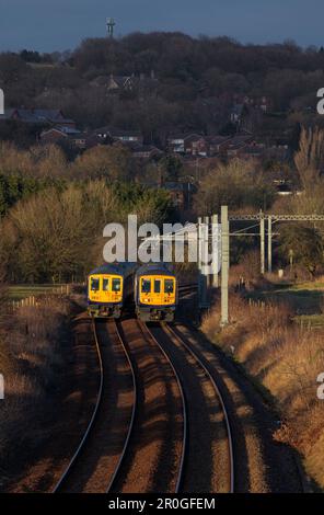 2 Northern Rail class 769 flex bi mode trains passing at Lostock junction, the end of the electrified section while running on diesel. Stock Photo