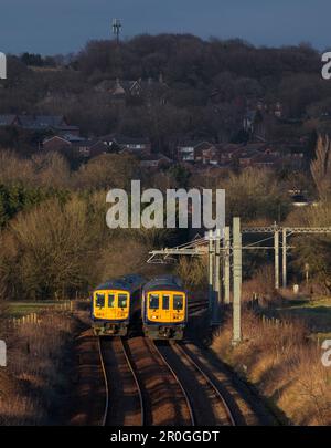 2 Northern Rail class 769 flex bi mode trains passing at Lostock junction, the end of the electrified section while running on diesel. Stock Photo