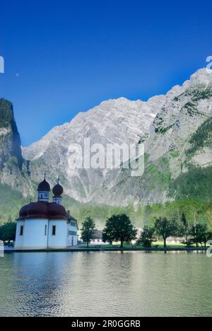 Church of St. Bartholomae standing in front of the eastern face of Watzmann, lake Koenigssee, Berchtesgaden national park, Berchtesgaden mountain rang Stock Photo