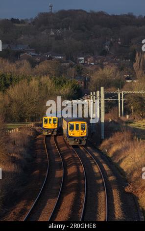 2 Northern Rail class 769 flex bi mode trains passing at Lostock junction, the end of the electrified section while running on diesel. Stock Photo