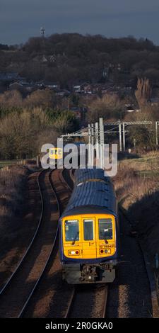 2 Northern Rail class 769 flex bi mode trains passing at Lostock junction, the end of the electrified section while running on diesel. Stock Photo