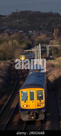 2 Northern Rail class 769 flex bi mode trains passing at Lostock junction, the end of the electrified section while running on diesel. Stock Photo