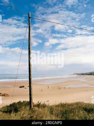 Power pole, Playa de Meron, San Vicente de la Barquera, Parque Natural de Oyambre, Cantabria, Spain Stock Photo